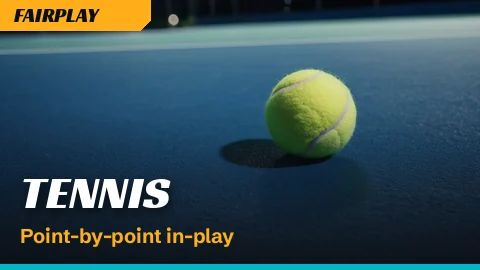 Tennis ball and racket strings lit on a hard court